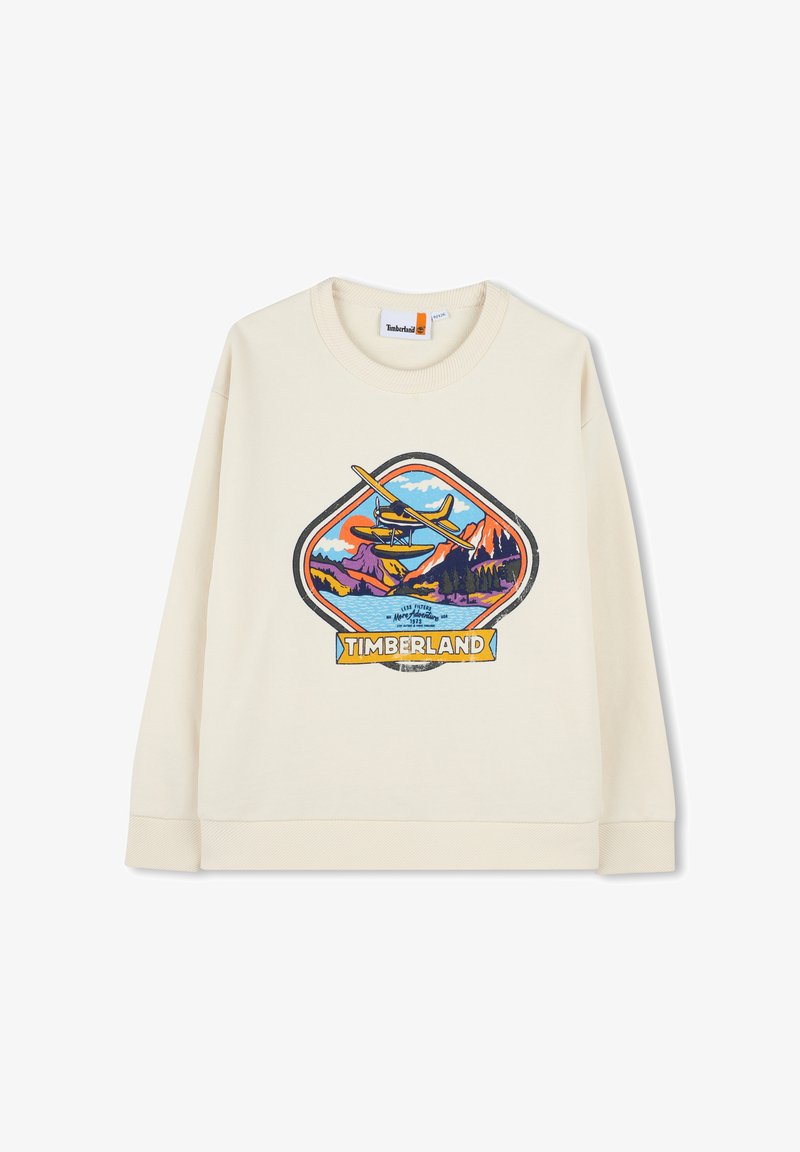 Crème-kleurige sweatshirt met een grafisch logo van bergen, een meer en een vliegtuig, benadrukt door blauwe, oranje en groene accenten.