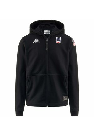 Felpa nera con cappuccio e zip, realizzata in tessuto morbido, con un logo sul petto, la bandiera degli Stati Uniti sulla manica e due tasche nella parte frontale.