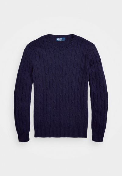 Pull en maille côtelée bleu marine avec un col rond et des poignets et un ourlet côtelés. Fabriqué en tissu doux et texturé. Silhouette classique et ajustée.