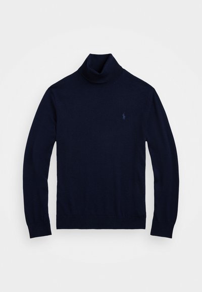 Navyfarbener Rollkragenpullover aus weichem Strickmaterial. Mit langen Ärmeln und ribbeligem Saum. Beinhaltet ein kleines Logo auf der Brust.