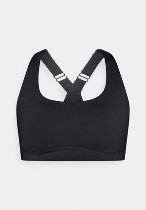 Reggiseno sportivo nero con spalline larghe e design incrociato. Presenta una texture liscia e una cucitura curva nella parte inferiore per il supporto.