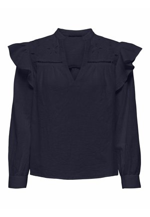 Navy blue long-sleeve blouse with ruffled shoulder details, V-neckline, and subtle embroidered cutouts along the upper chest and shoulders.
