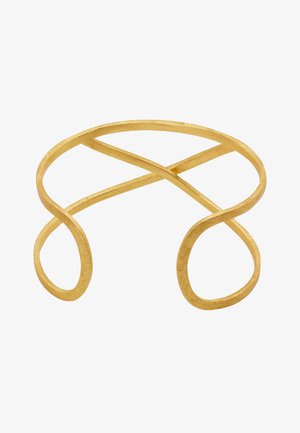 Złota metalowa bransoletka w kształcie opaski z otwartym designem, charakteryzująca się zakrzywionymi i przecinającymi się liniami, teksturowaną powierzchnią oraz zaokrąglonymi końcami.