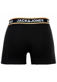 Svarta boxershorts i stretchbomull med midjeband i guld och svart som har "JACK&JONES"-logotypen. Slät textur och kroppsnära passform.