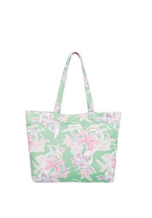Grüne Tragetasche mit einem Blumenmuster in Pink und Weiß, zwei Trägern und einem kleinen Etikett auf der Vorderseite. Aus Baumwolle oder Leinen.