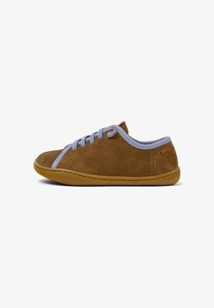 Brown suede sneaker with light blue laces and a tan rubber sole, featuring a small red tag on the back. Side view, plain background.