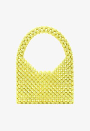 Żółta torebka na koralikach z okrągłą rączką, z teksturowaną powierzchnią z małych, błyszczących kulistych koralików ułożonych w wzór kratki.