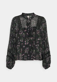 Blusa nera con un motivo floreale in viola e verde, inserti trasparenti, dettaglio con collo a cravatta e maniche a sbuffo elasticizzate.