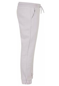 Ljuslila sweatpants tillverkade av mjukt tyg, med elastisk midja, justerbar dragsko och sidofickor.