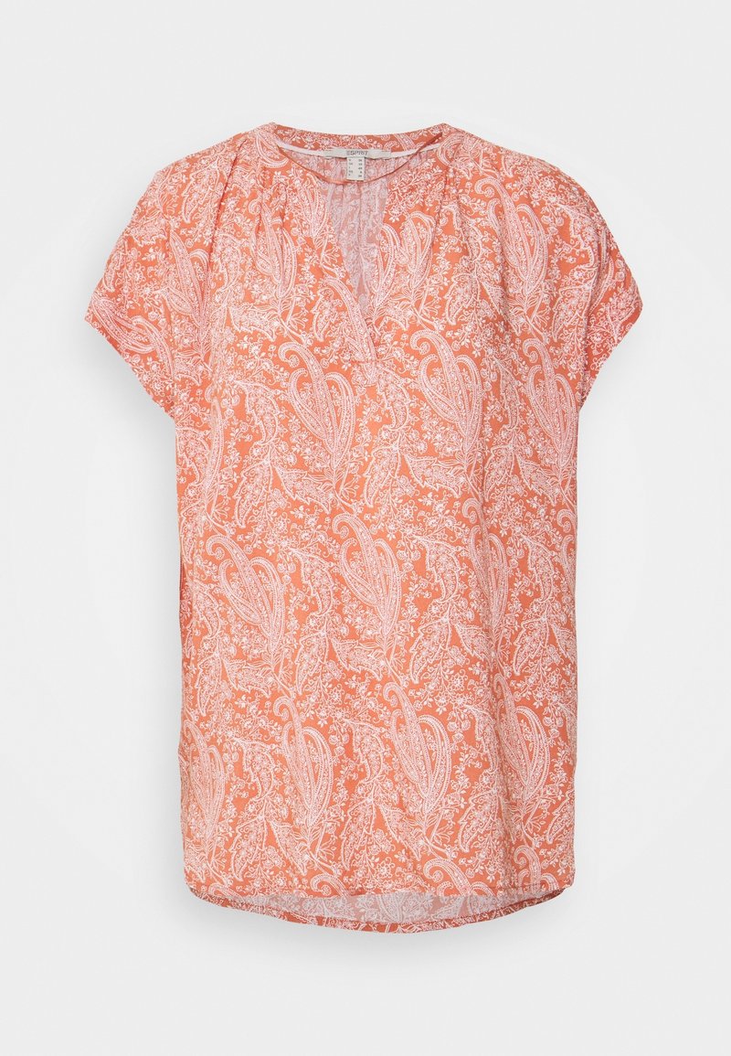 Blouse corail à manches courtes avec motif paisley et floral blanc, col en V et coupe ample.