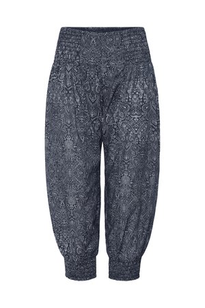 Tmavě modré kalhoty Capri s bílým složitým paisley vzorem, elastickým pasem a elastickými lemy u kotníků.