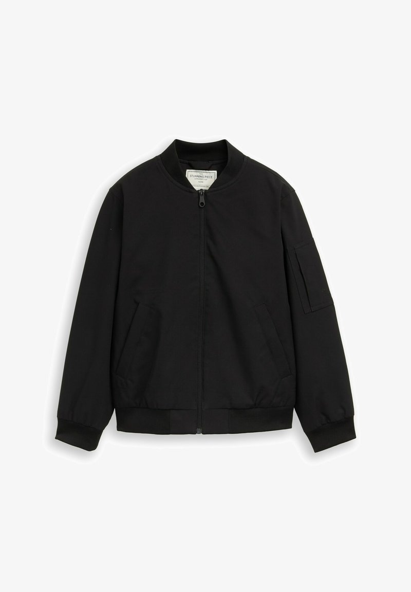 Black bomber jacket with front zipper, ribbed collar and cuffs, two front pockets, and a zippered pocket on the left sleeve.