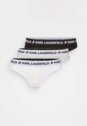 Three pairs of women's thongs in white, black, and grey, featuring elastic waistbands with "KARL LAGERFELD" logo and a distinctive logo design.