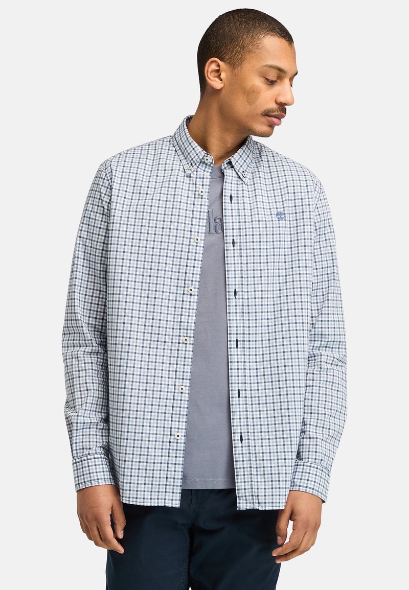 Overhemd met knopen in wit en marineblauw plaid, gemaakt van geweven stof, met lange mouwen, een kraag en een klein logo detail op de borst.