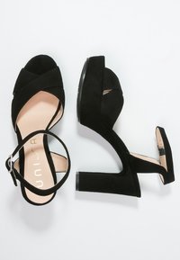 Unisa Sandaletter - black