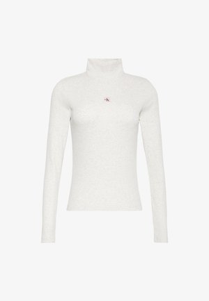 Chemise à manches longues gris clair avec col roulé et petit logo "ck" rouge et noir centré sur la poitrine.
