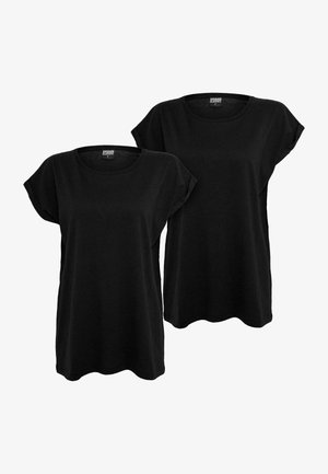 Črne bombažne majice, okrogla ovratnica, kratki rokavi, ohlapen kroj, raven spodnji rob, prikazane v paru. Brez opaznih vzorcev ali poudarkov.