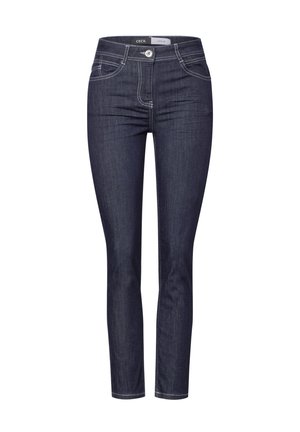 Jean skinny en denim bleu foncé avec des surpiqûres contrastantes, taille mi-haute, design à cinq poches et fermeture à bouton à l'avant.