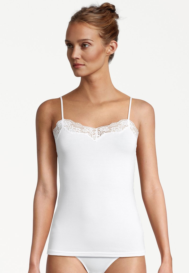 White camisole with thin straps, featuring a lace trim along the neckline. Made from soft cotton with a smooth texture and fitted design.