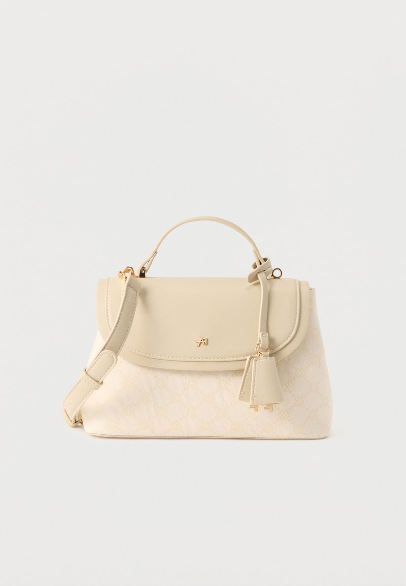 Μπεζ τσάντα με πάνω λαβή, ρυθμιζόμενο ιμάντα ώμου, κλείσιμο με καπάκι, διακριτικό μοτίβο μονόγραμμα και μικρή δερμάτινη ταμπέλα προσαρτημένη.