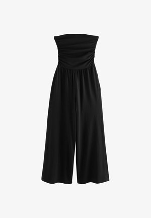 Sort stropløs jumpsuit med en rynket overdel, elastisk talje og vidbenet design. Fremstillet af et blødt, glat stof med mat finish.