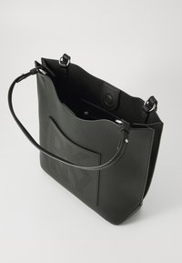 Black leather tote bag with textured surface, top handles, and an embossed logo panel. Open top with inner zipper pocket for storage.