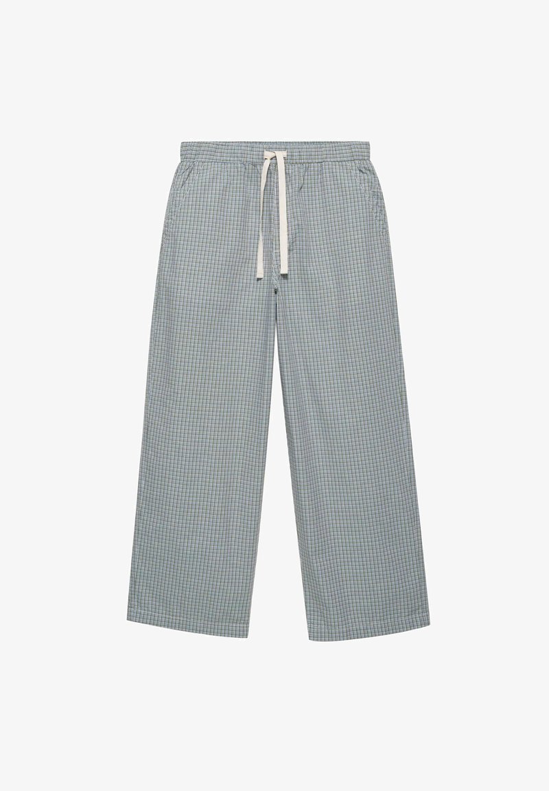 Pantalon large gris clair à carreaux avec taille élastique et cordon blanc, avec poches latérales.