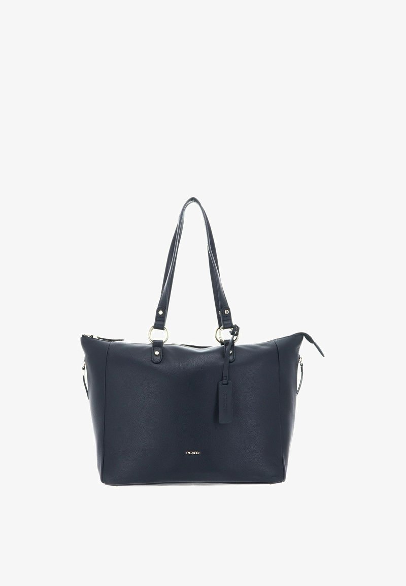 Sac fourre-tout en cuir bleu marine foncé avec double anses, fermeture éclair et quincaillerie dorée. Il dispose d'un logo bien visible et d'une étiquette amovible.
