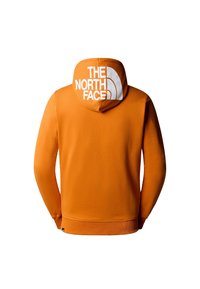 Felpa arancione con il logo "The North Face" stampato in bianco sul retro del cappuccio, mostrata piatta e rivolta verso il basso.