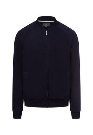 Marinefarbener Zip-Jacke aus glattem Material. Verfügt über Raglanärmel, einen gerippten Kragen, seitliche Taschen und einen figurbetonten Saum mit elastischen Bündchen.