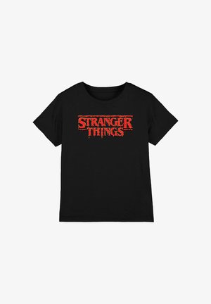 Black cotton t-shirt featuring "STRANGER THINGS" logo in dripping red letters across the chest. Short sleeves and crew neck design.