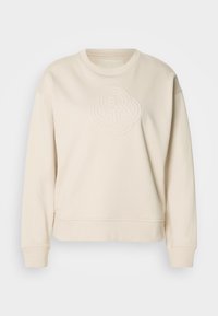Sweat-shirt beige à manches longues avec col rond et motif circulaire embossé subtil centré sur la poitrine.