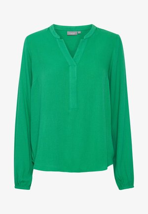 Žalia ilgomis rankovėmis palaidinė su V formos apykakle, tekstūruotas audinys ir elastingi rankogaliai. Sukuria laisvą siluetą ir turi subtilų raštą.