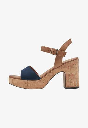 Navy blue suede sandal with cork platform and heel, featuring a brown adjustable ankle strap and open toe design.