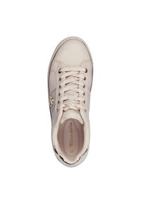 Light beige sneaker with lace-up closure, leather-like material, rounded toe, subtle logo detail, and padded collar for comfort.