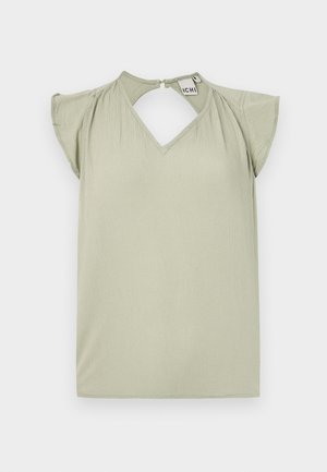 Short-sleeve, light green top with a V-neckline and keyhole back detail. Made of smooth fabric; features soft ruffles at the shoulders.