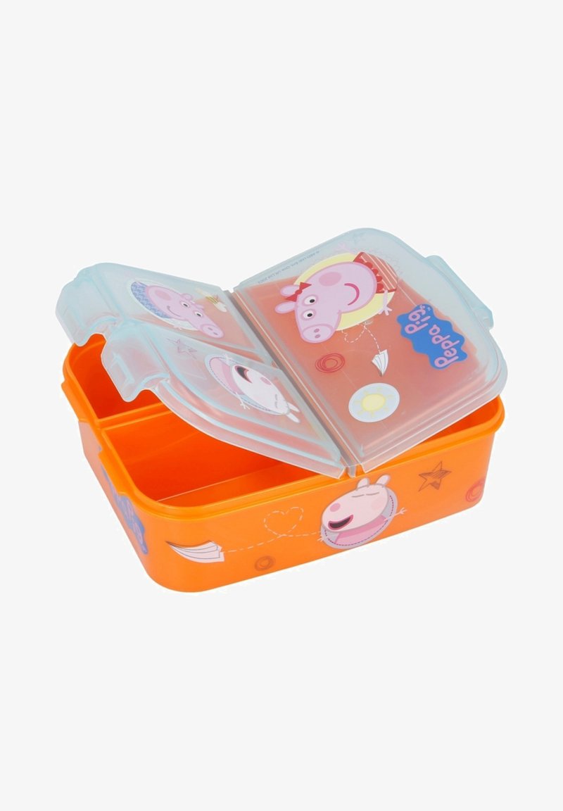 Boîte à lunch en plastique orange avec deux compartiments, couvercle transparent illustré de motifs de cochons de dessin animé et d'accents colorés. Texture de surface lisse.