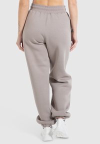 Smilodox Teplákové kalhoty - hellbraun