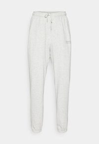 Šviesiai pilki sportiniai ilgiai su elastingu juosmeniu, raišteliu ir susiaurintais kraštais. Kairėje pusėje yra diskretiškas žalias logotipas.