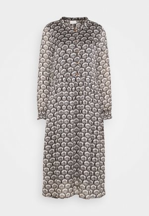Robe midi à manches longues avec motif floral noir et blanc, boutonnée devant, taille froncée et poignets élastiques.