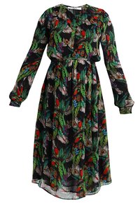 Robe noire à fleurs avec manches longues, taille cintrée et silhouette fluide. Le tissu présente des feuilles vertes vives et des fleurs colorées.