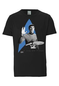 Black cotton t-shirt featuring a graphic of a character in a gray uniform, making a Vulcan salute, with a blue star emblem and text below.
