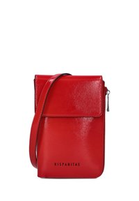 Red leather crossbody bag with a glossy finish, flap closure, side zipper, and embossed brand name "HISPANITAS" on the front.