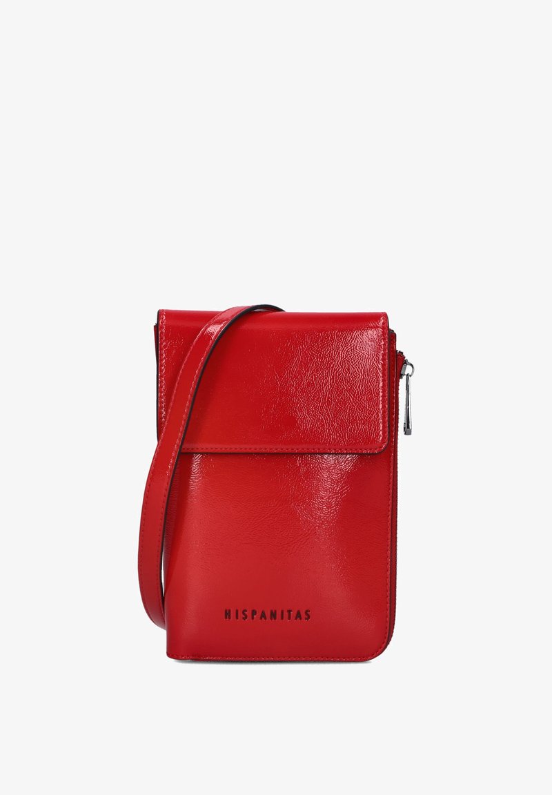 Red leather crossbody bag with a glossy finish, flap closure, side zipper, and embossed brand name "HISPANITAS" on the front.
