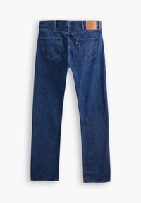 Dark blue denim jeans with a straight-leg cut, featuring two back pockets, and a tan leather label at the waistband. No visible distressing.