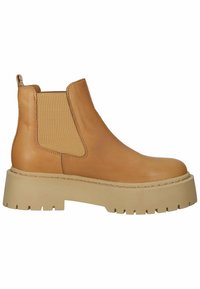 Botte Chelsea en cuir beige avec une semelle épaisse beige à crampons et un empiècement latéral élastique, vue de profil sur fond blanc.