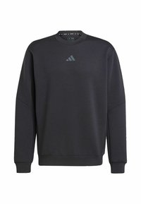 Black sweatshirt made of soft fabric, featuring a crew neck, ribbed cuffs, and a subtle Adidas logo in dark gray on the chest.