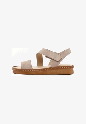 Beige suede women's sandal with adjustable velcro straps and a cushioned brown platform sole.