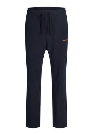 Tamsiai mėlynos laisvalaikio kelnės su elastinga juosmens juosta ir raišteliais, tiesiomis kojų siūlėmis ir mažais auksiniais siuvinėjimais dešinėje klubo pusėje.