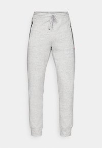 Grijze sportieve joggings met een zacht materiaal, voorzien van een elastische tailleband met trekkoord, ritszakken aan de zijkant en aansluitende boorden.